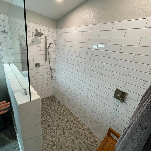 Subway tile in a shower by Cornerstone Flooring Brokers in Glendale AZ