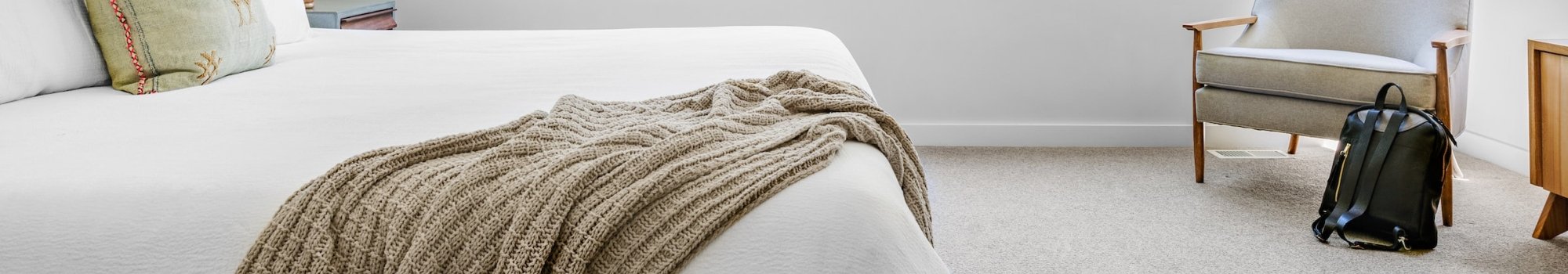 Light carpet in a minimal and cozy bedroom